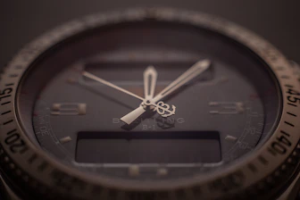 Close-up of a sleek premium watch with a digital interface overlay.