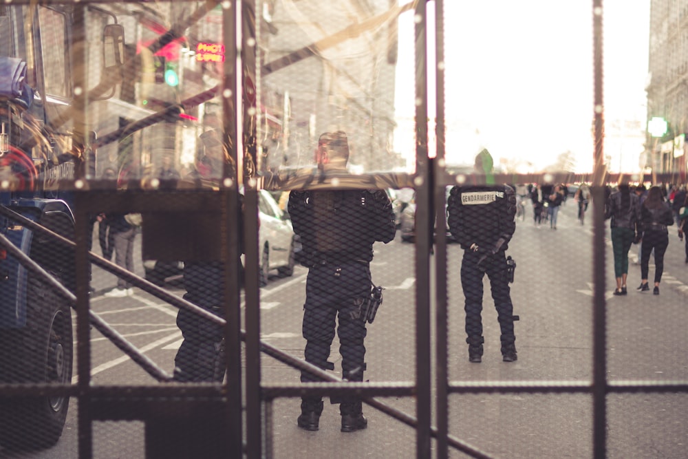 person wearing black police suit