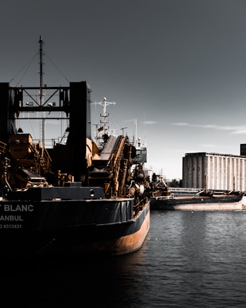 Bulk vessel loaded with silica sand docked at a Western Australian port under clear skies.