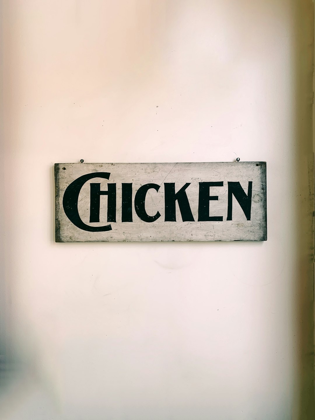 brown and black wooden chicken signboard