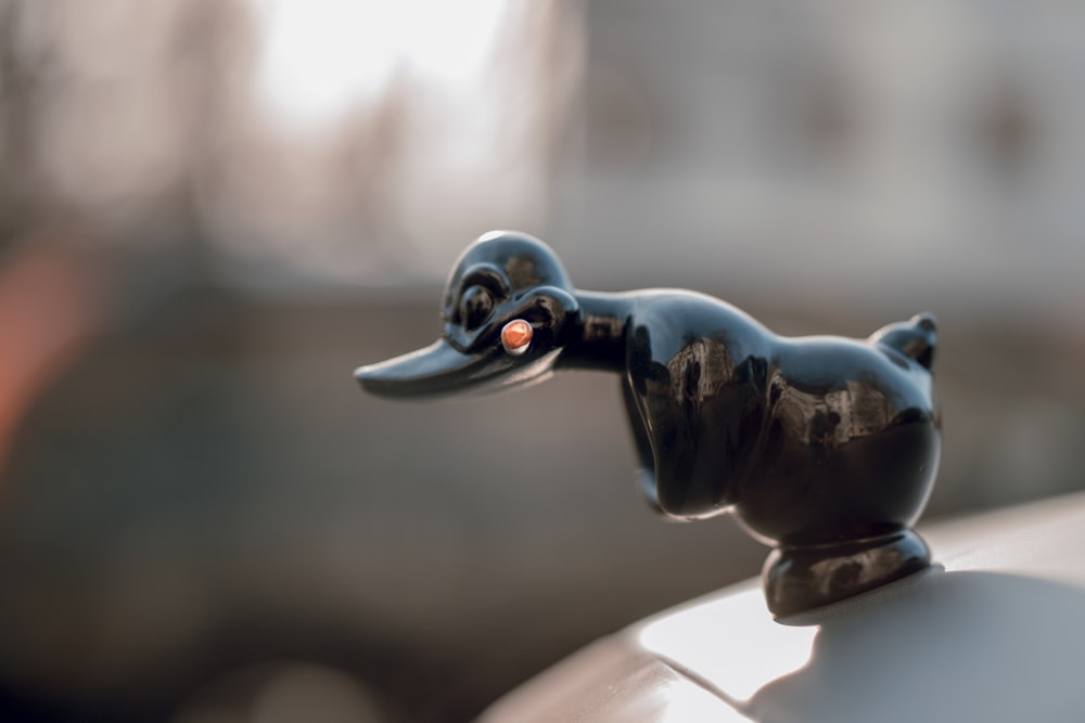 black ceramic duck figurine