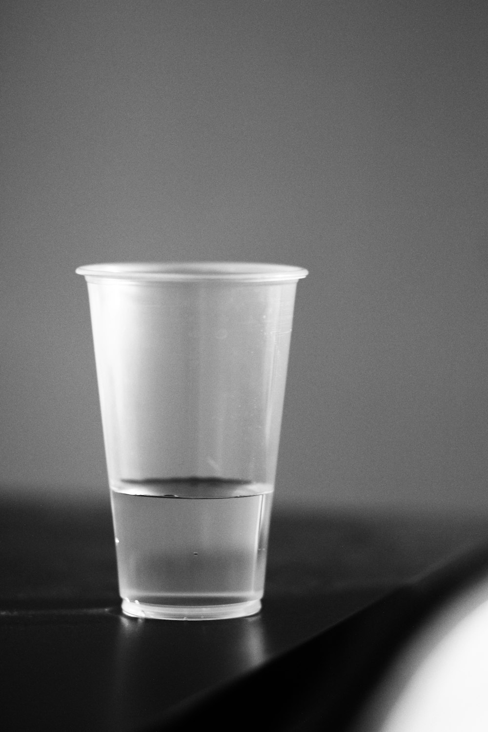 Premium Photo  Empty transparent coffee cup made of glass isolated on black  background
