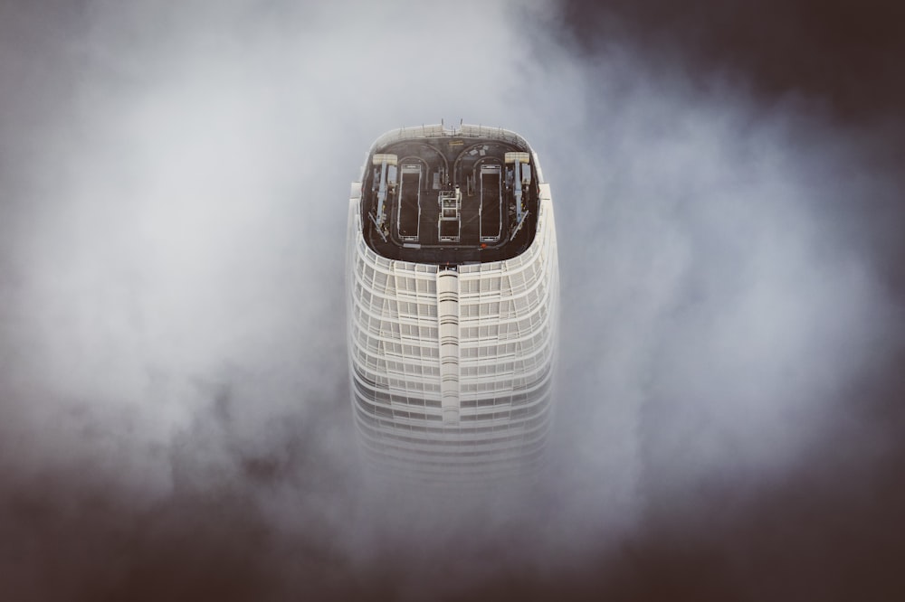 white and black concrete building under white clouds