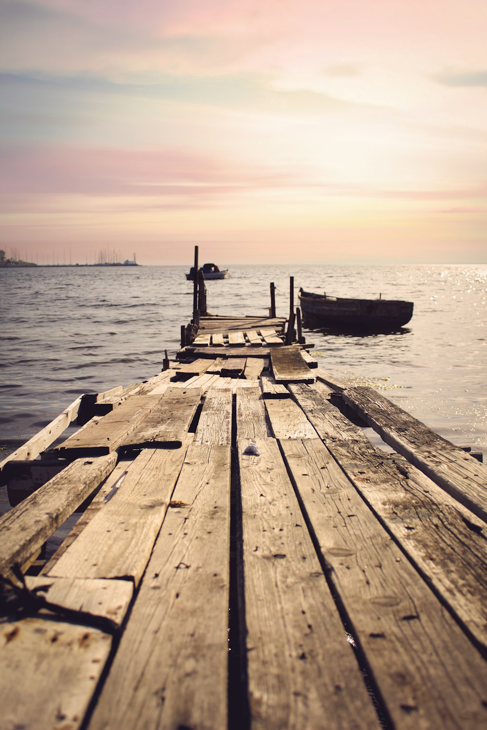 a boat is docked at the end of a pier