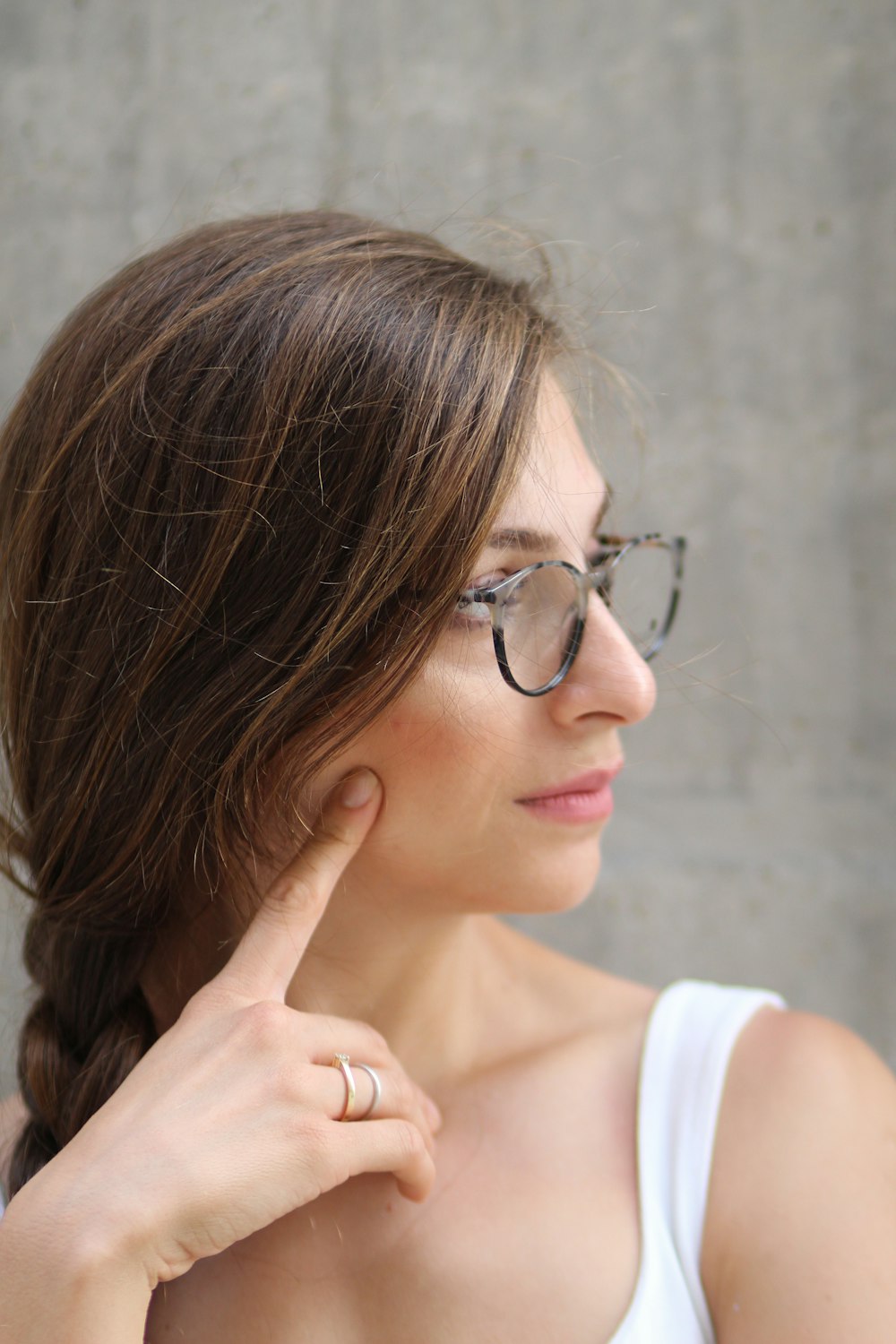 woman in eyeglasses and white sleeveless to