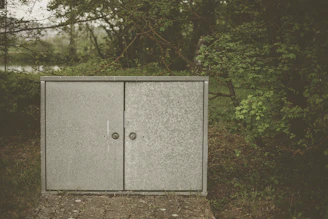 Sleek industrial metal storage cabinet under a sturdy waterproof awning outdoors