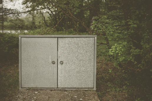 Sleek industrial metal storage cabinet under a sturdy waterproof awning outdoors