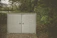 A terraviva weatherproof cupboard standing strong outside during a rainy day.
