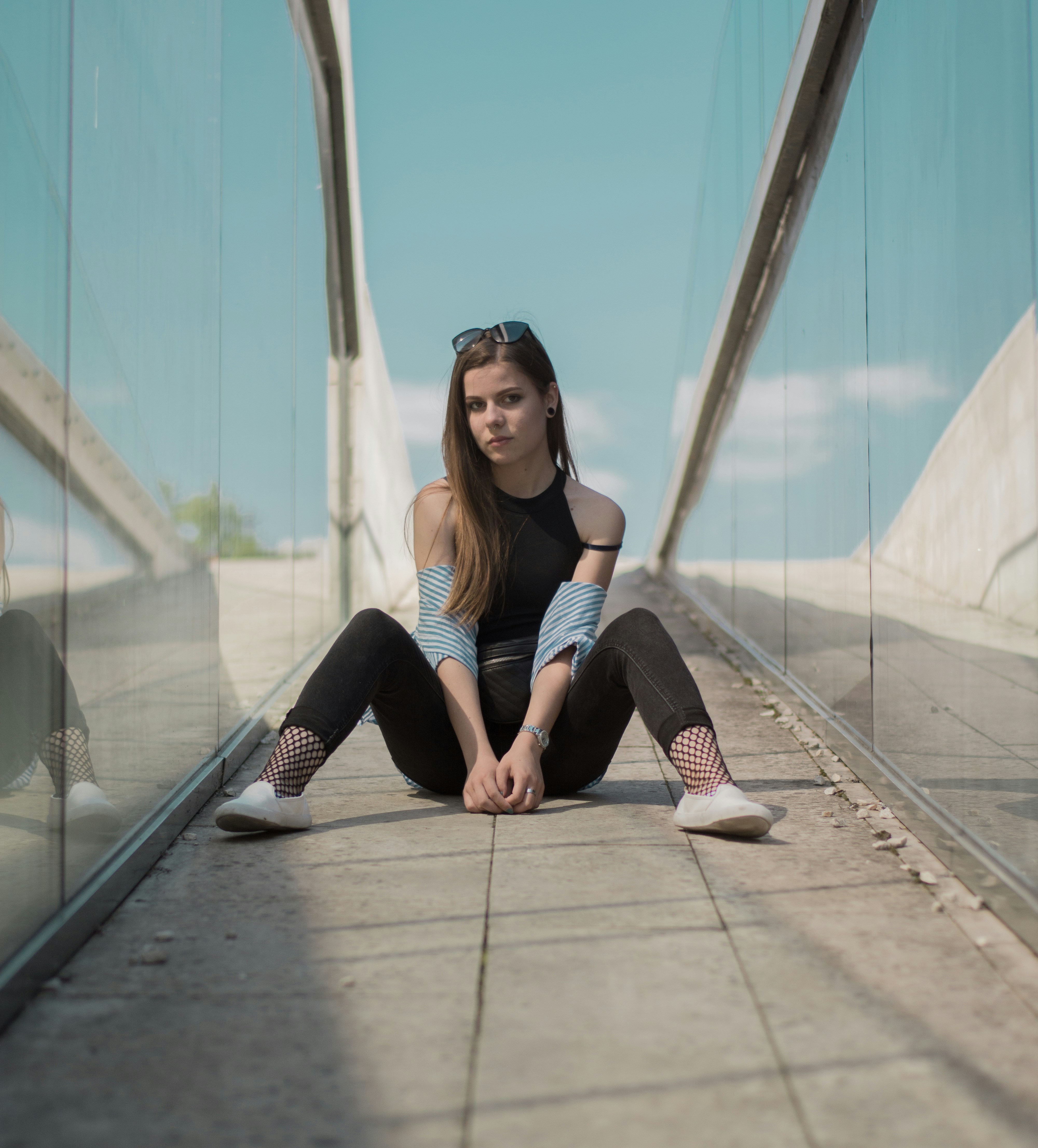 woman sitting on floor during daytime photo Free Apparel