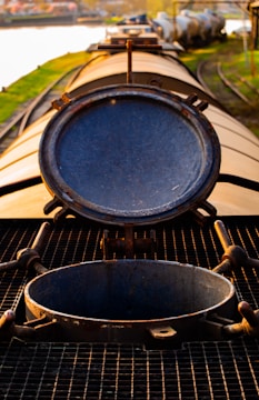 Close-up of a tank car being repaired with specialized tools