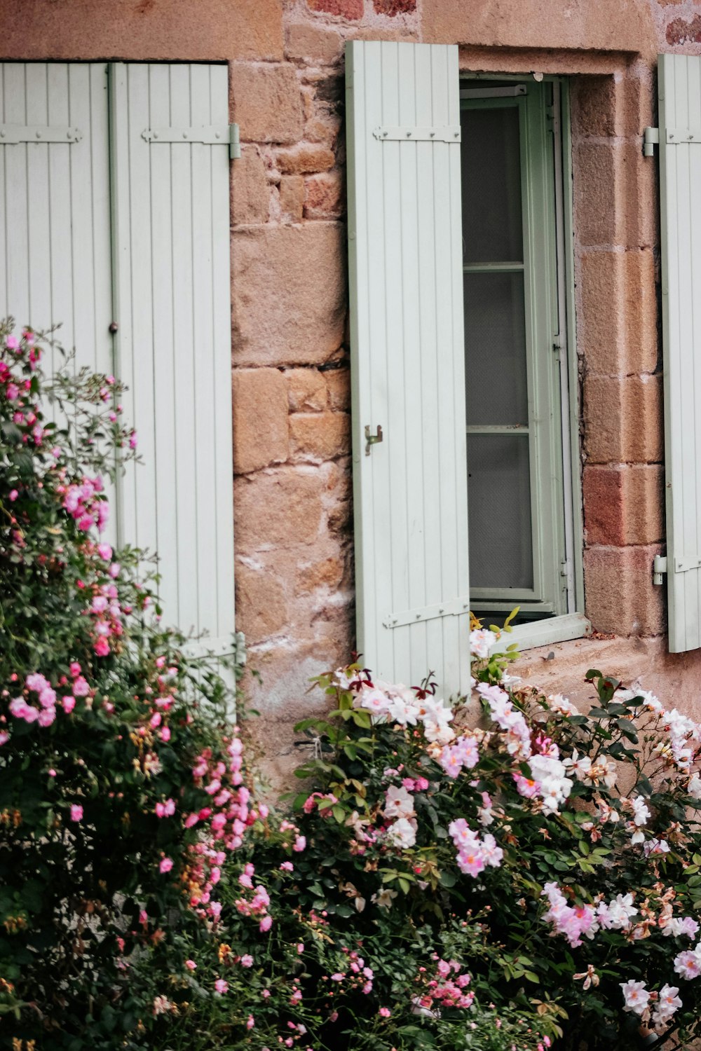 a building with a bunch of flowers in front of it