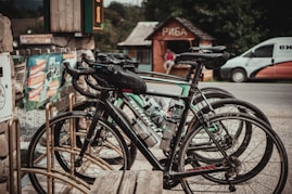 assorted bikes parked near wooden houses