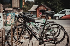 assorted bikes parked near wooden houses