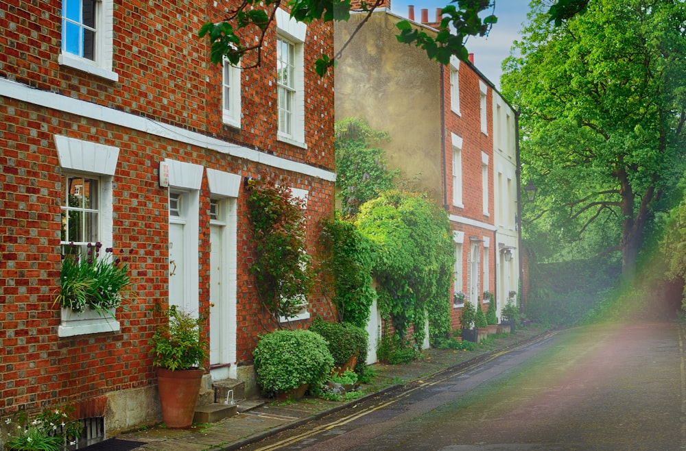 white and brown brick house near road during daytime