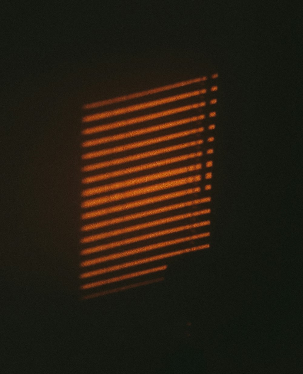 a close up of a window in the dark