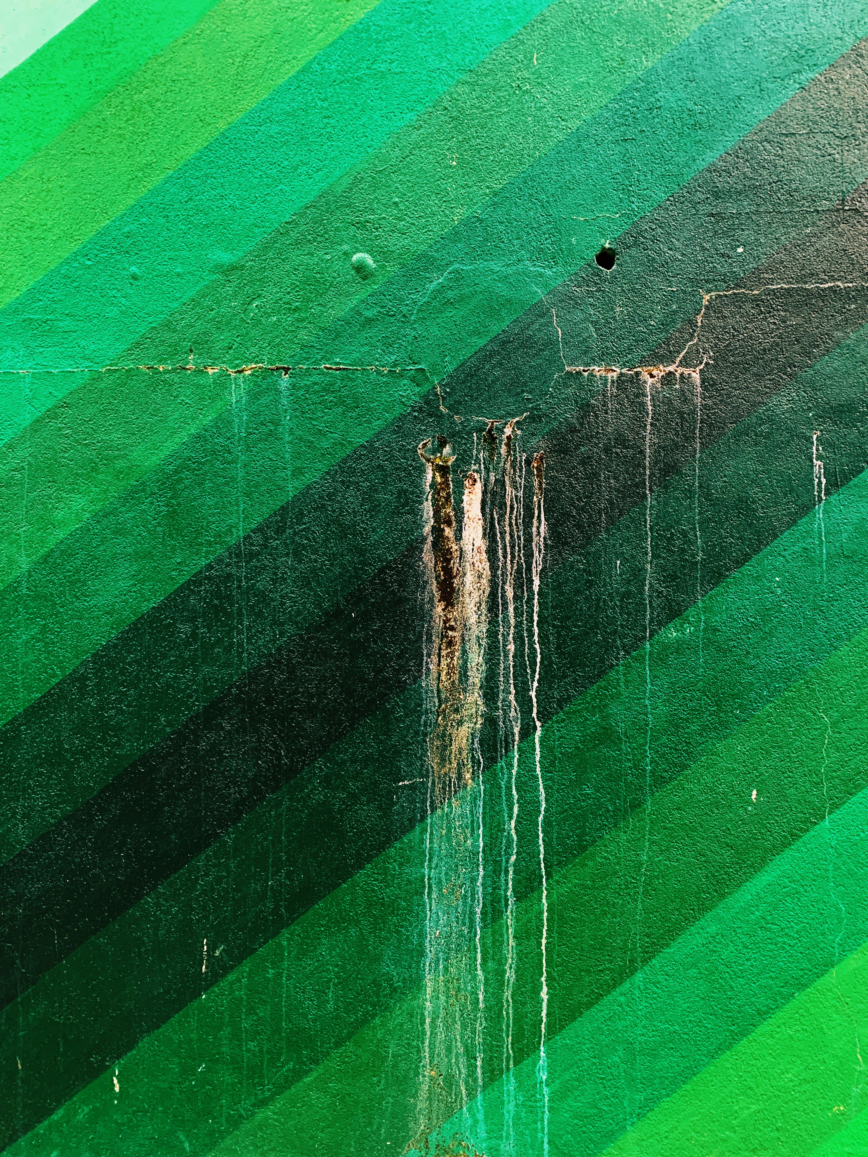 a picture of a green and black striped wall