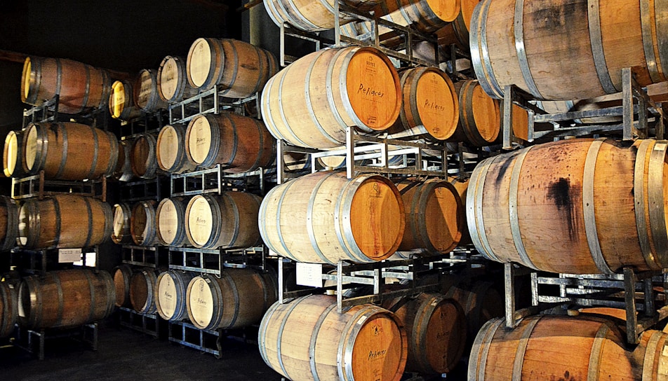 A bustling warehouse in Doral with stacks of wine and spirits ready for shipment.