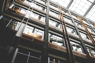 An architect carefully inspecting a modern apartment under natural light.