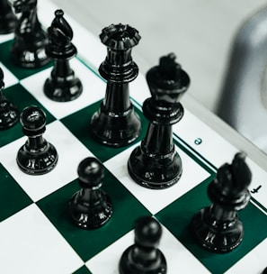 a close up of a chess board with pieces on it