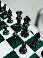 a close up of a chess board with pieces on it