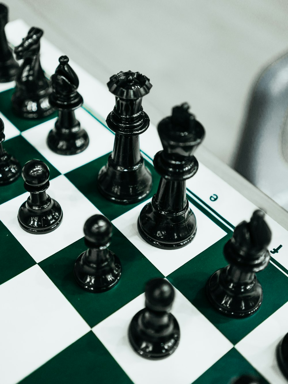 a close up of a chess board with pieces on it