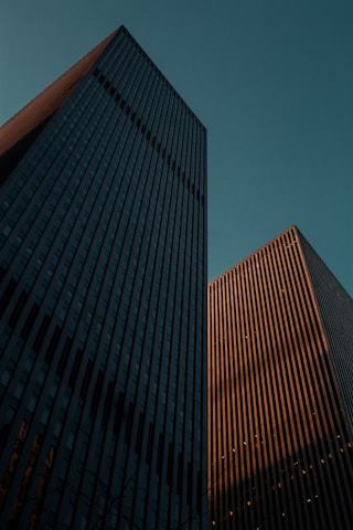 low angle photo of two high-rise buildings