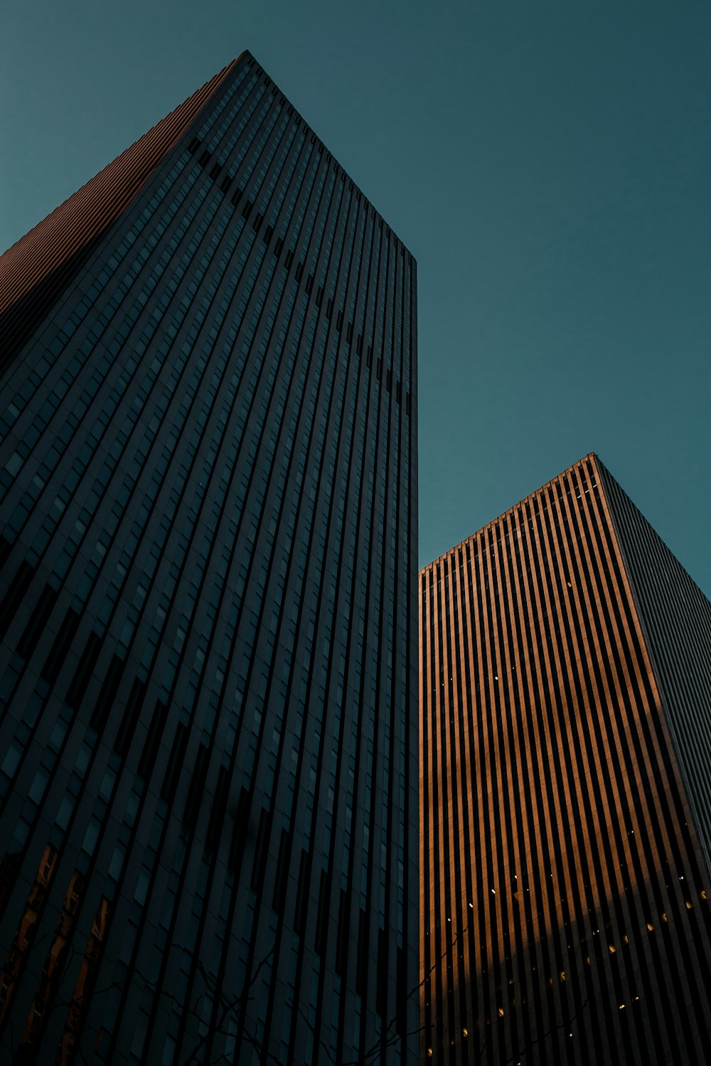 low angle photo of two high-rise buildings