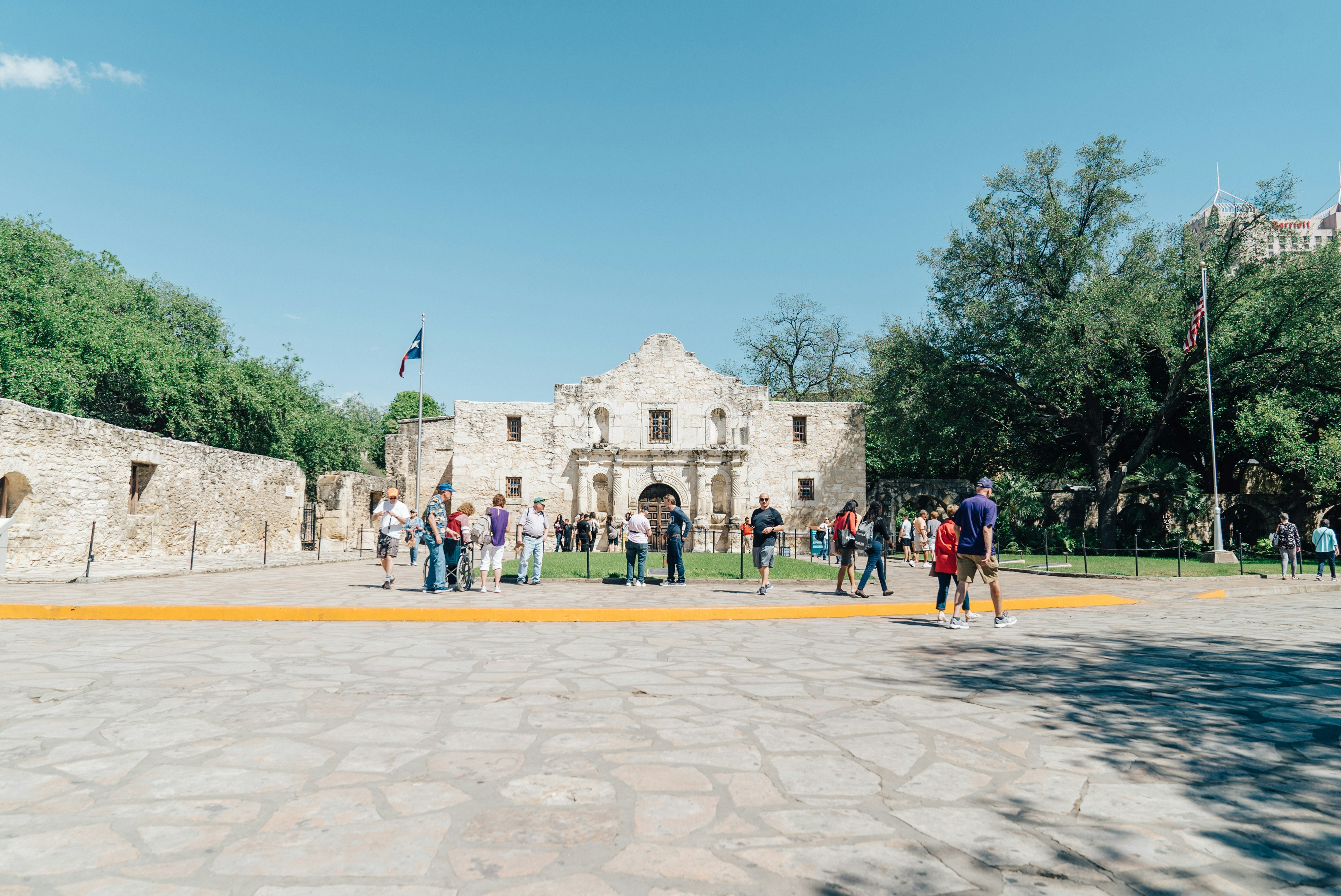 people at white concrete building during daytime