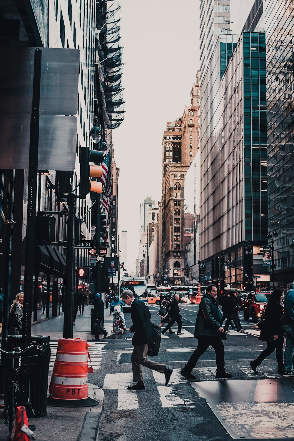 people crossing street during daytime