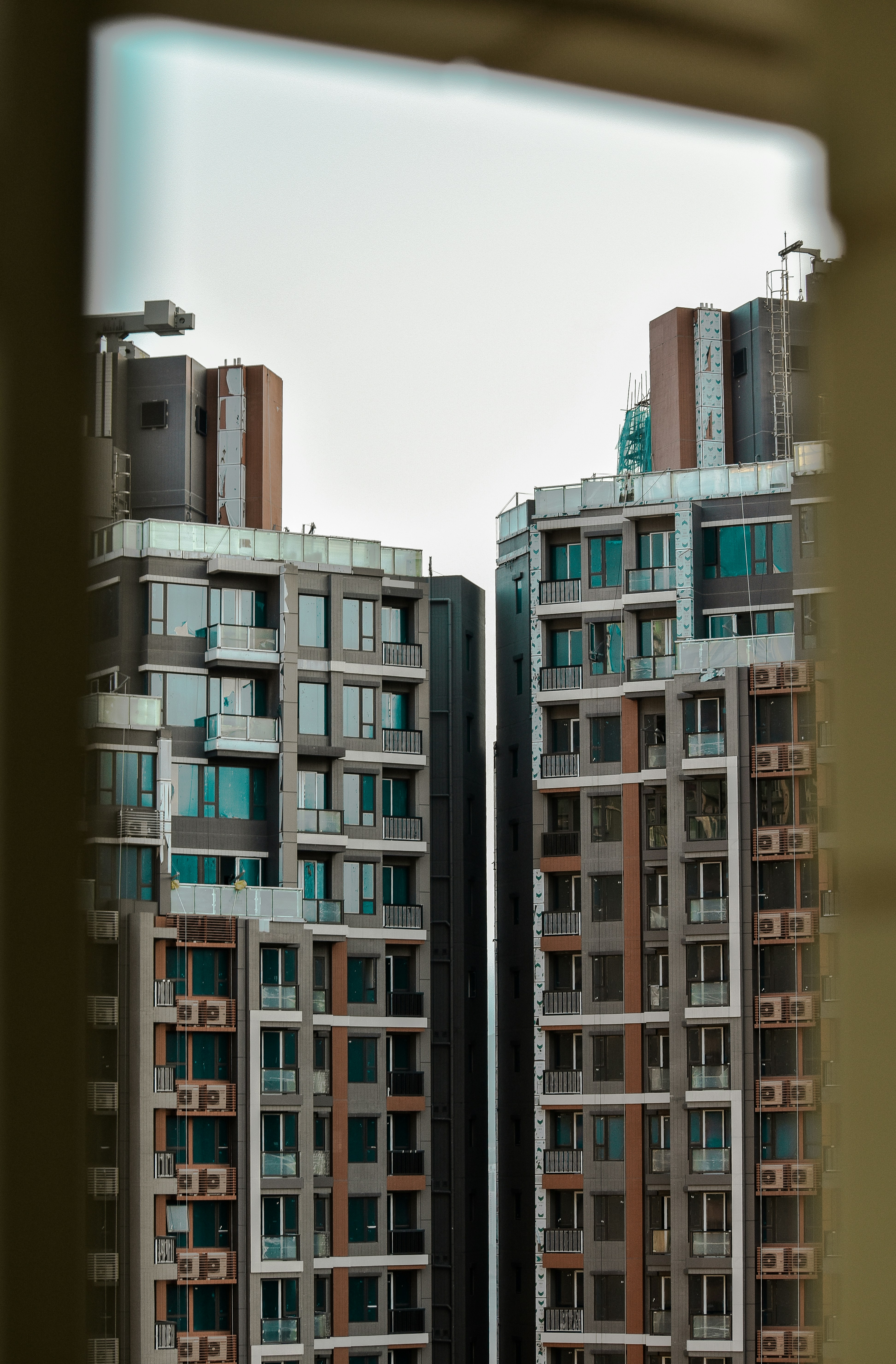 white and brown concrete high-rise glass curtain buildings during daytime