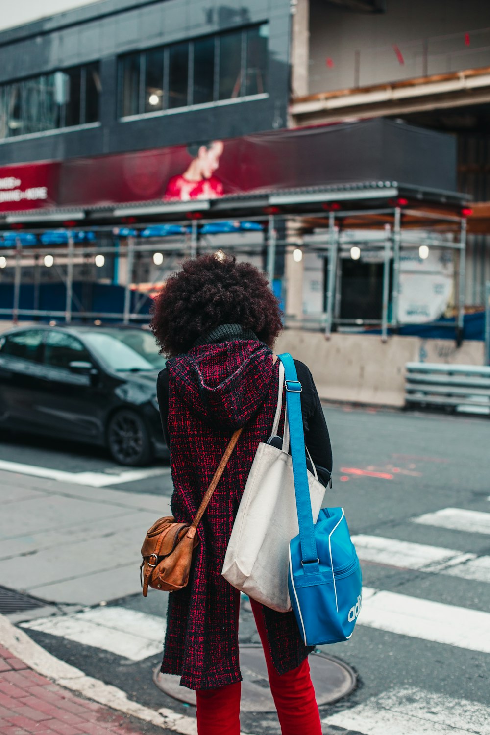 woman standing in front of pedestrian lane