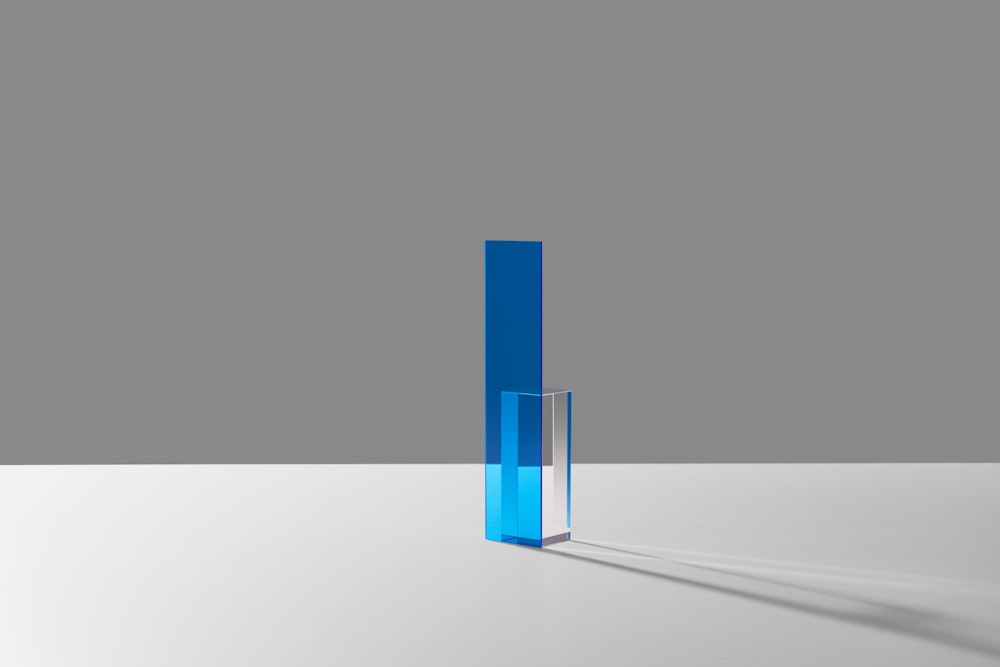 a tall blue object sitting on top of a white table