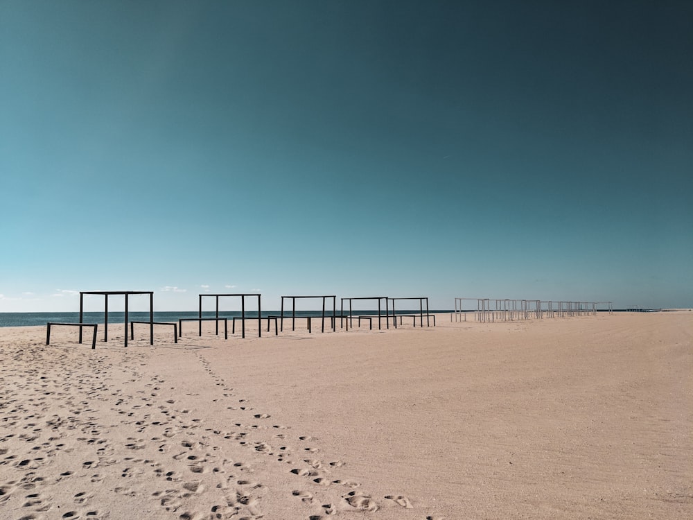 landscape photography of climb bars along seashore