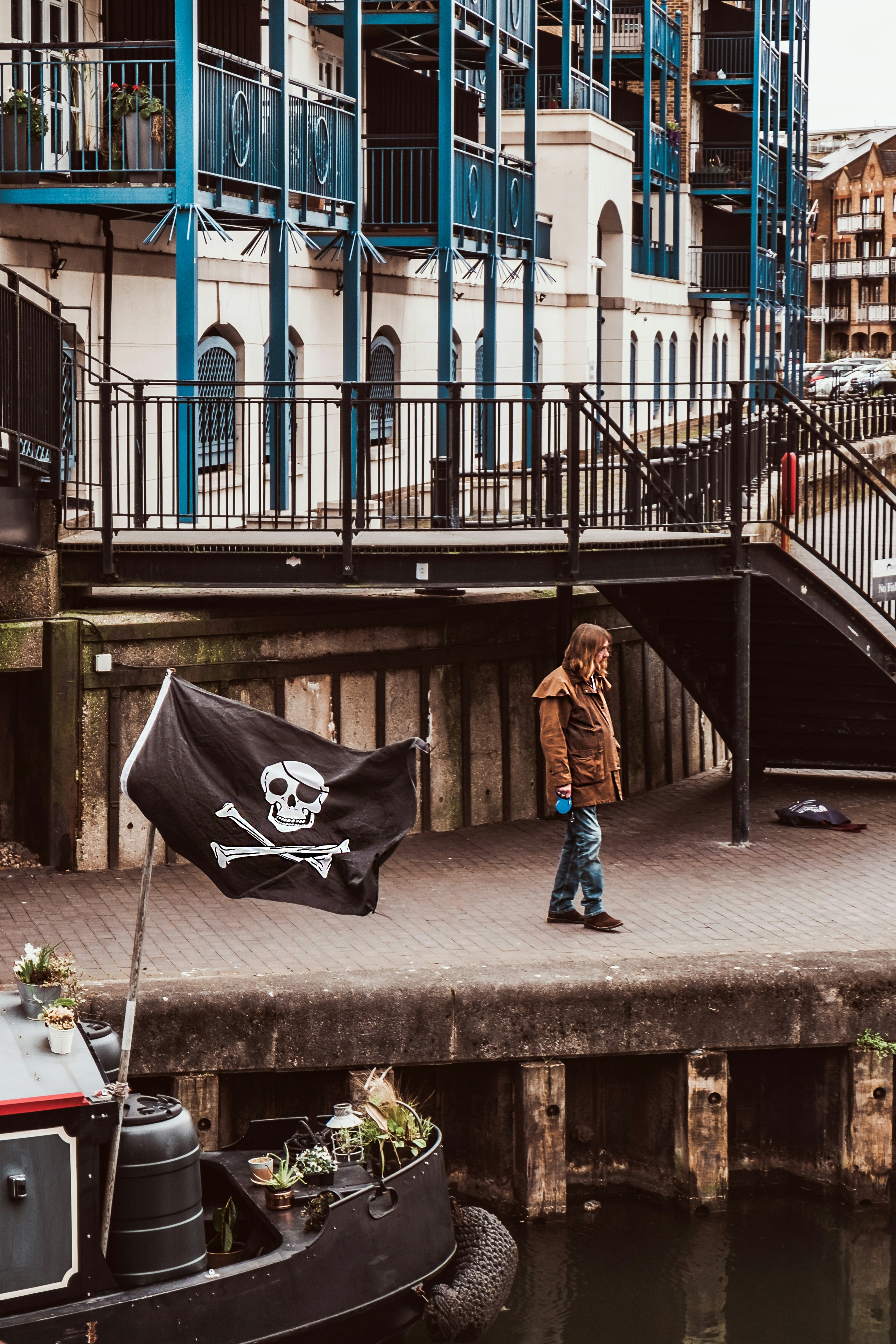 man standing on dockside