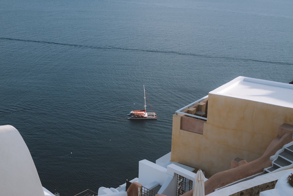 white ship on body of water