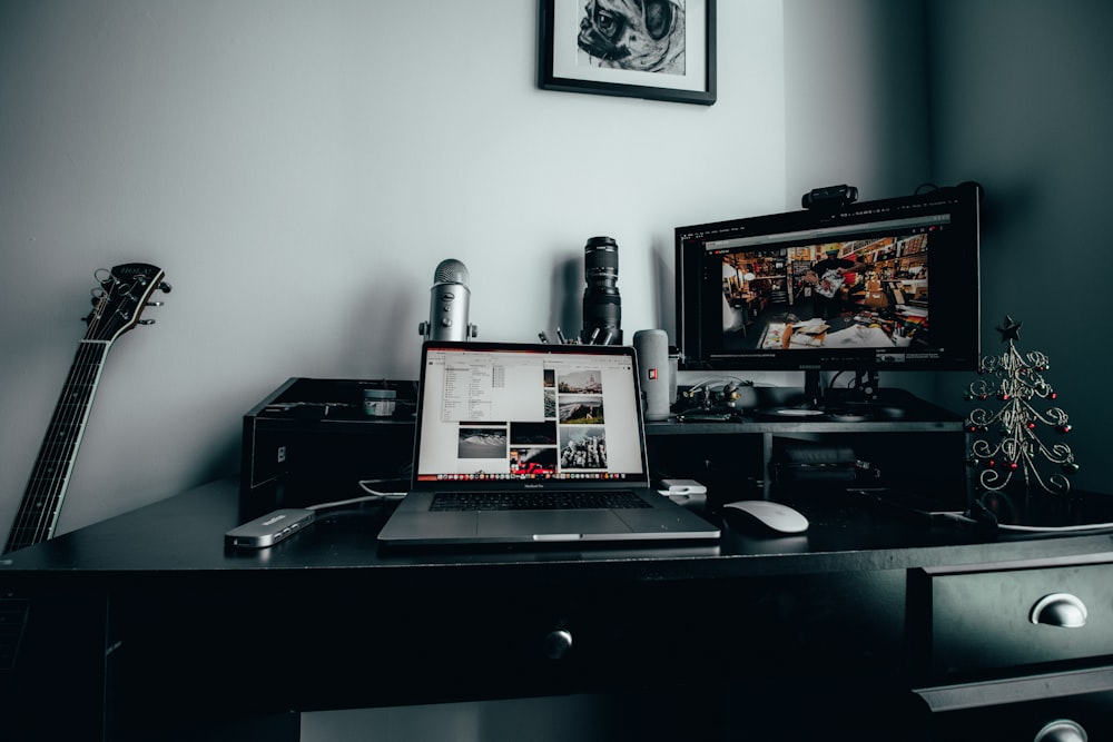 MacBook Pro, Magic Mouse, and monitor on desk