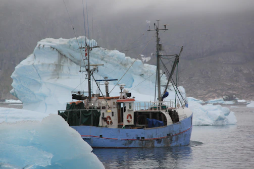 A fishing vessel equipped with advanced satellite communication gear navigating open waters.