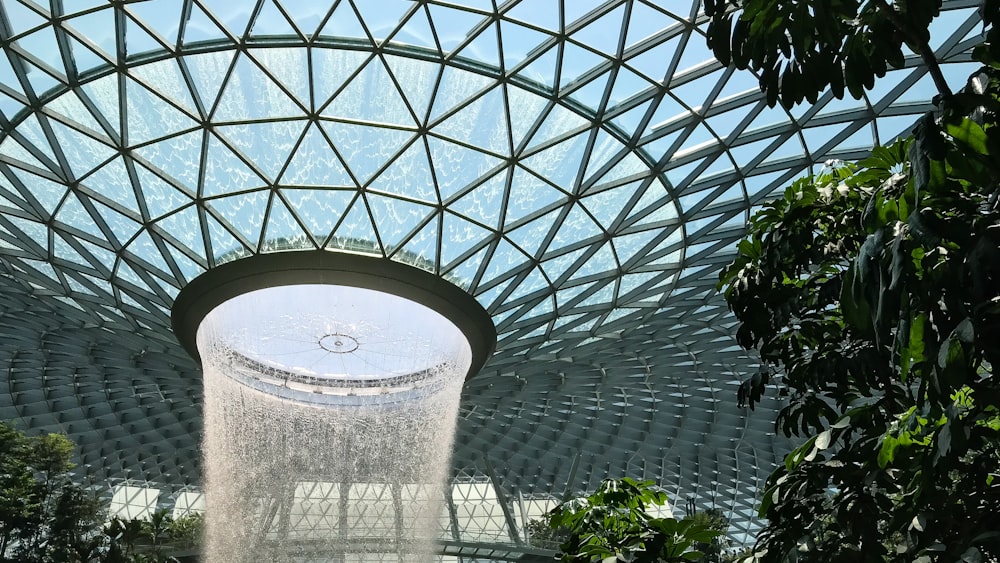 a water fountain inside of a large building