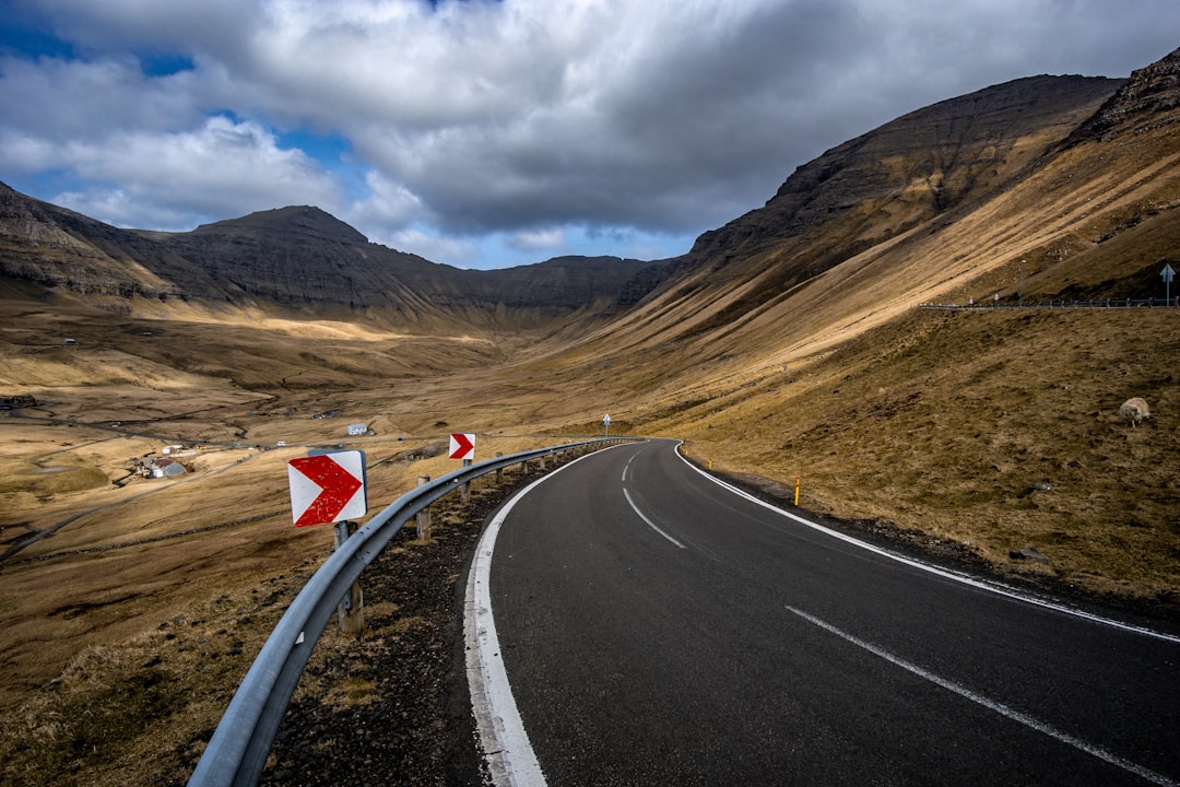 curved road near rock mountain