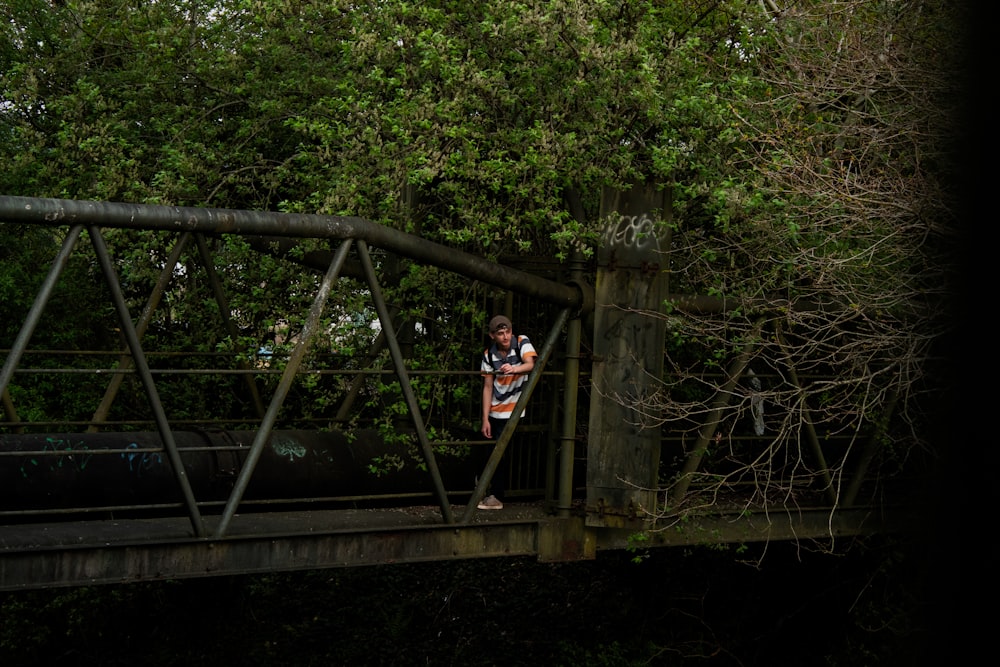 man standing on the bridge