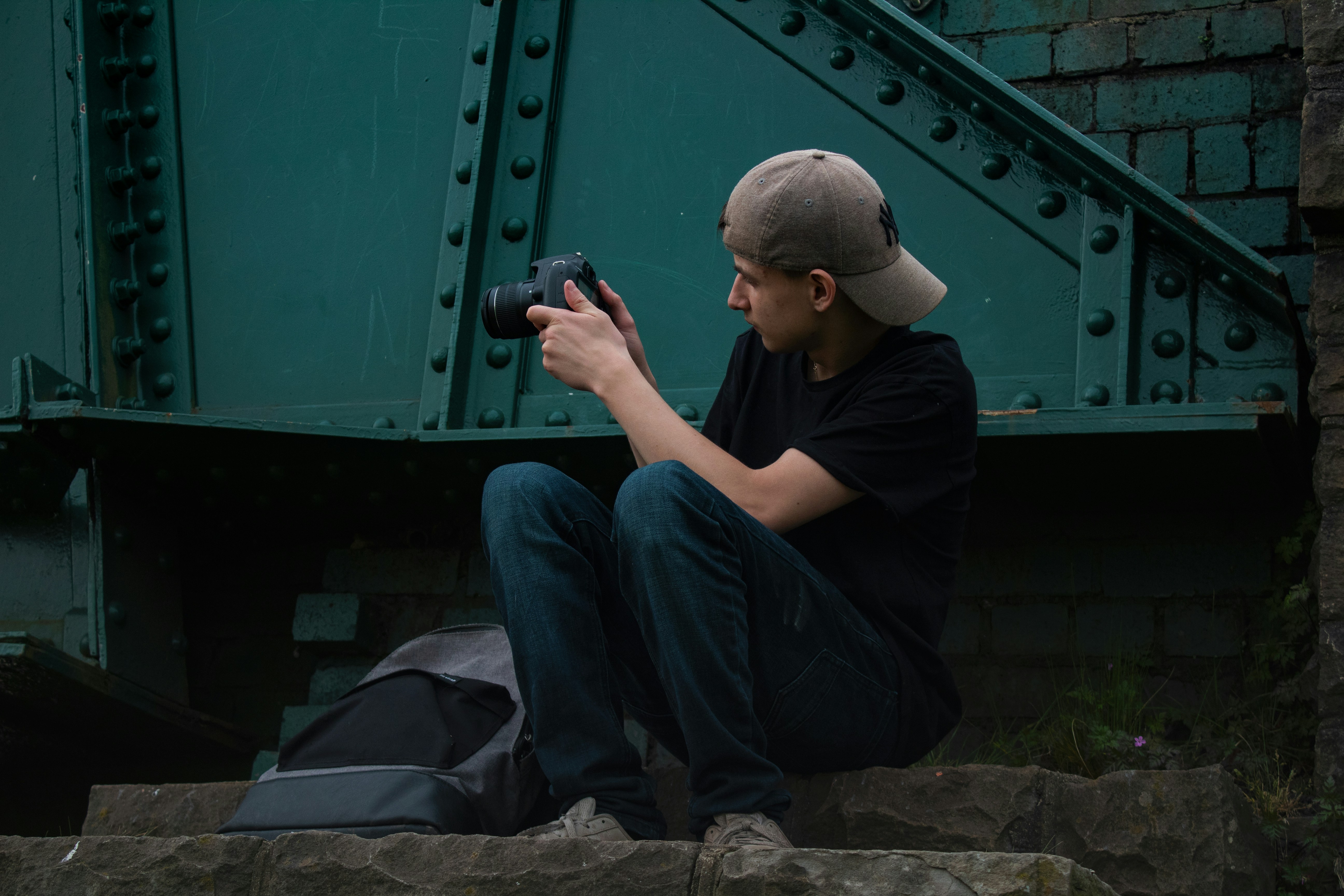 man holding DSLR camera