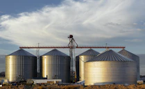 a group of large metal tanks sitting next to each other