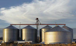 a group of large metal tanks sitting next to each other