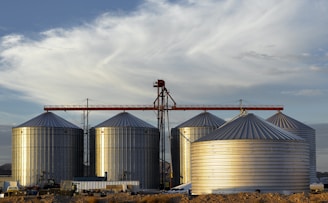 a group of large metal tanks sitting next to each other