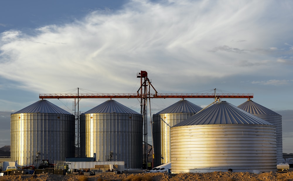 a group of large metal tanks sitting next to each other