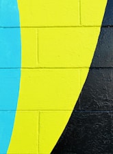 Bright pastel mural featuring playful shapes and soft curves on a wall.