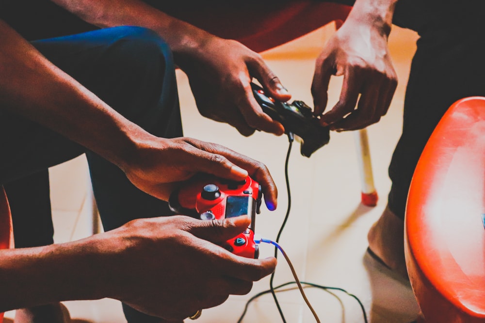 two person using corded controllers