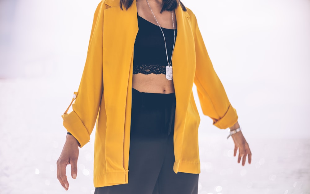 woman in yellow zip-up jacket