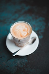 full-filled cup with saucer and teaspoon