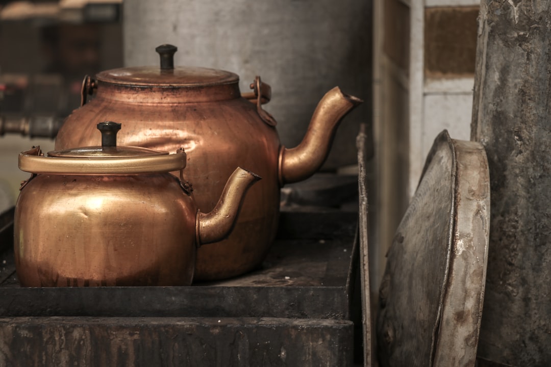 two brass teapot